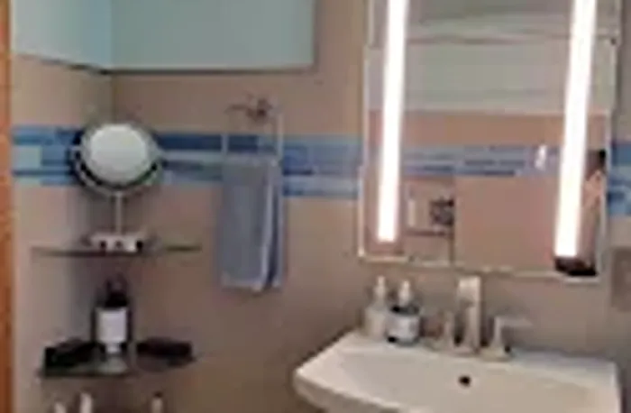 Tile installation in pink bathroom 